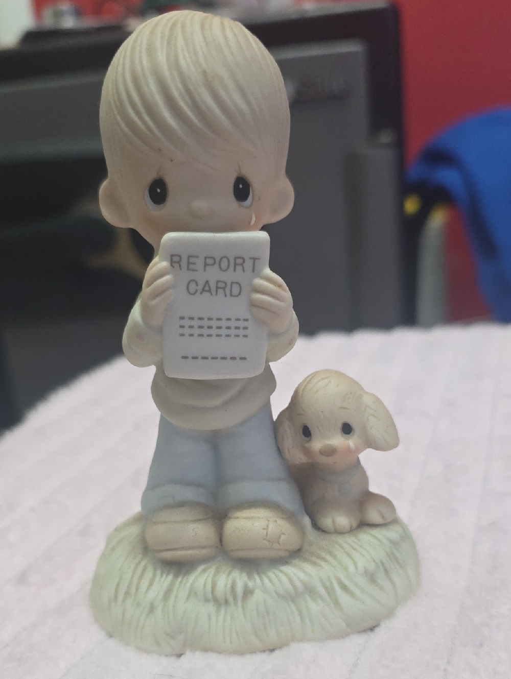 Precious Moments Boy Figurine Holding Report Card in Cream, White, Blue